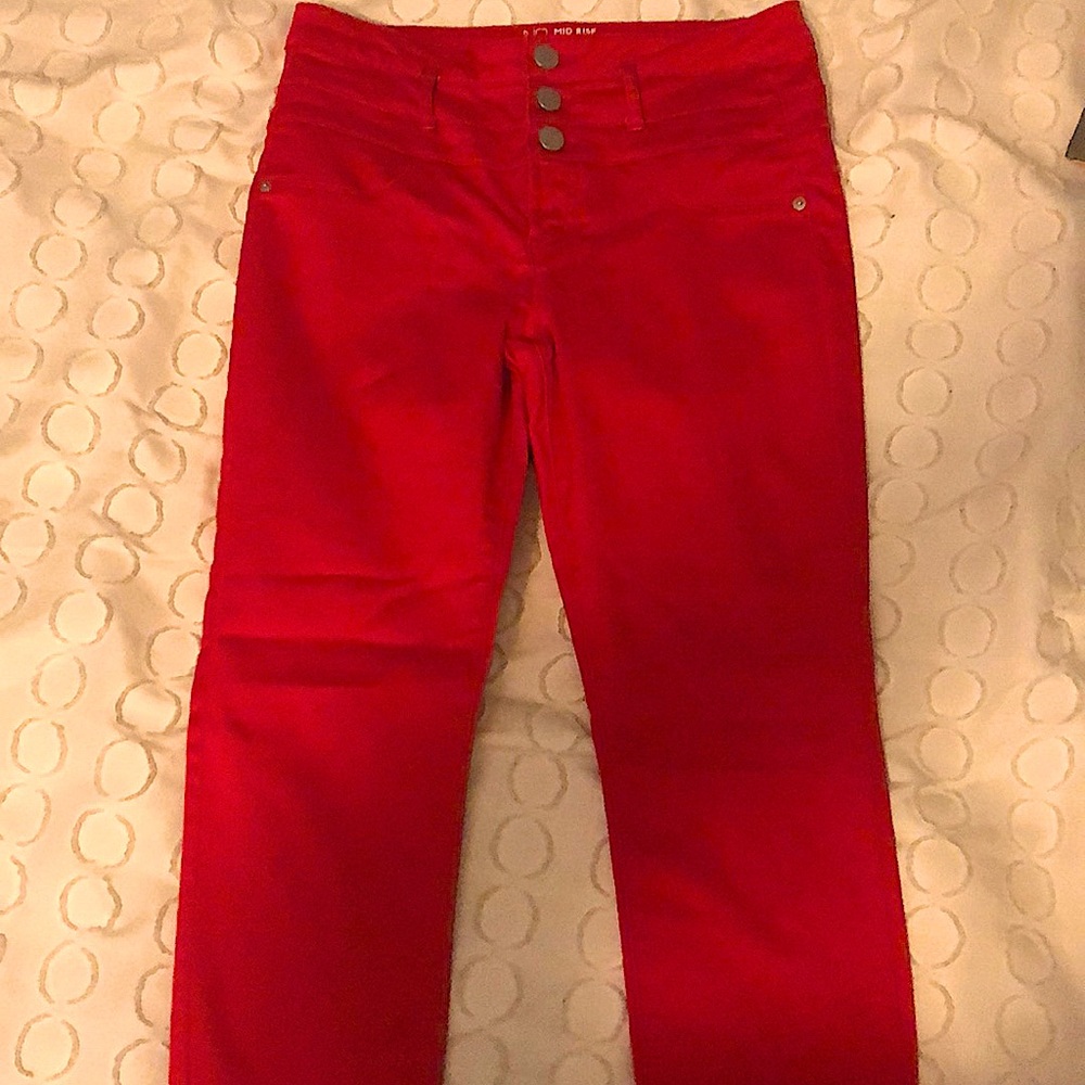 Red, mid-rise skinny jeans.